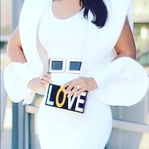 White Dress with Slits in the Sleeves.